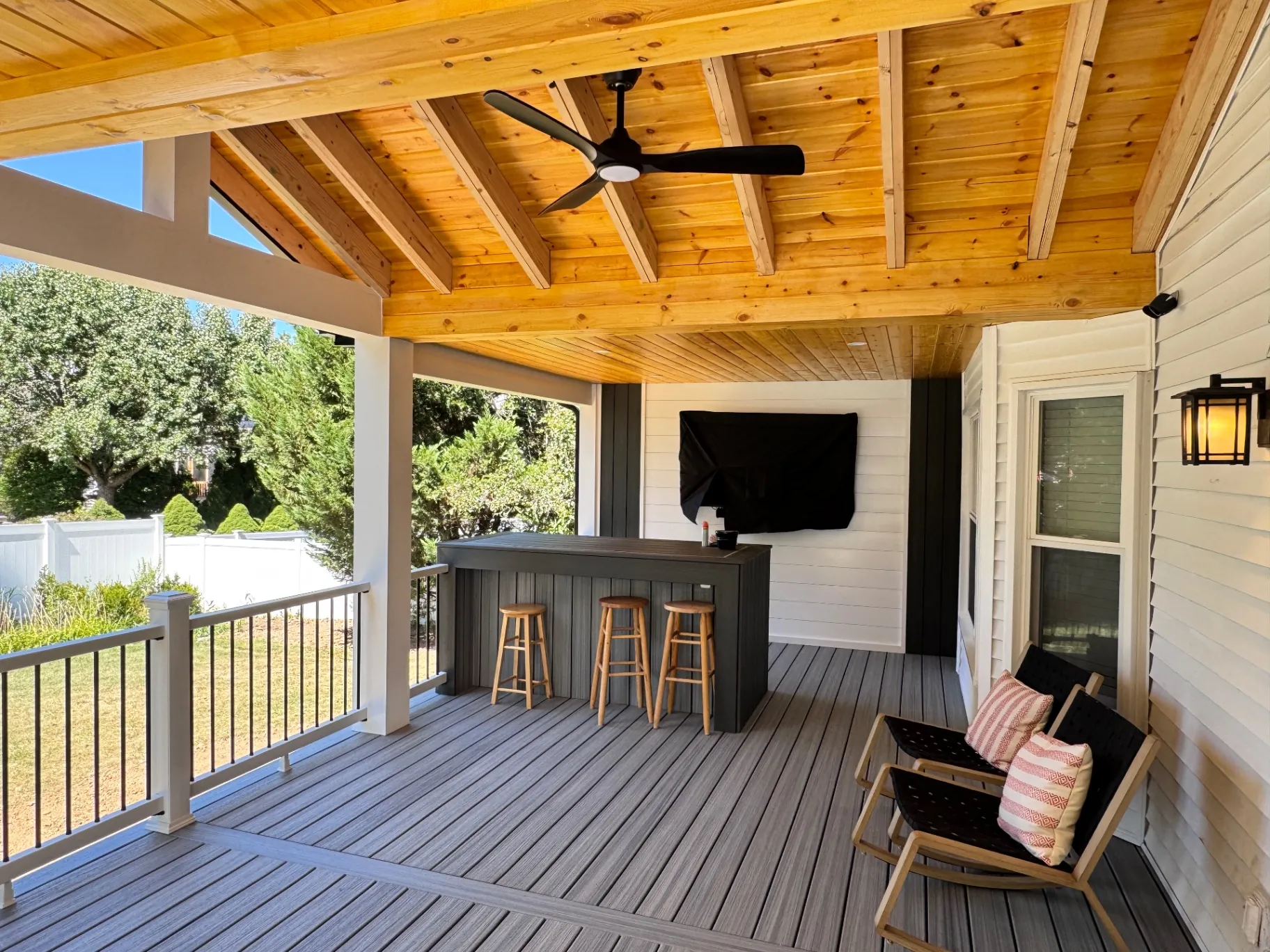 Covered deck with pine ceiling and outdoor bar in Newtown, PA