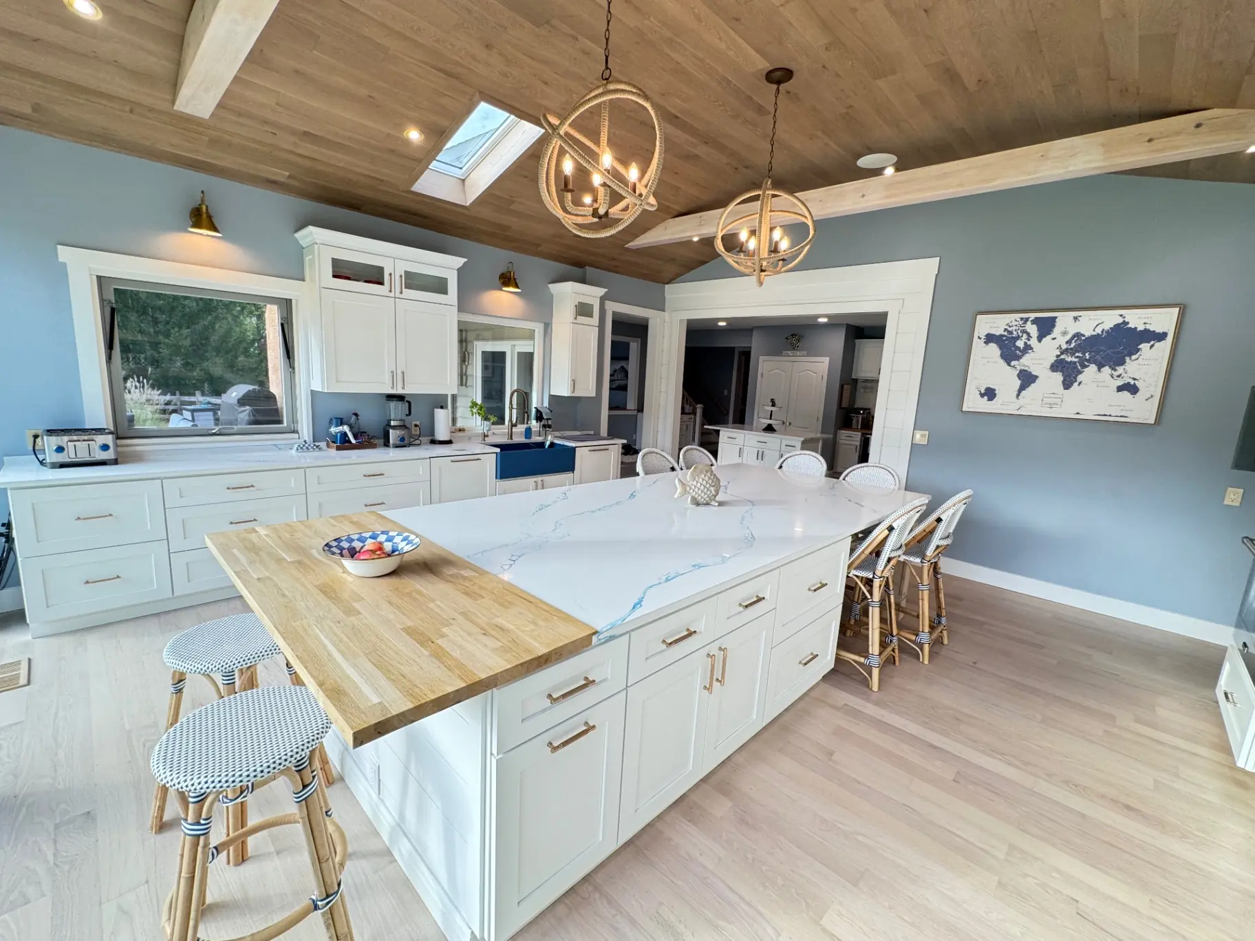 Large quartz kitchen island with blue veining and seating