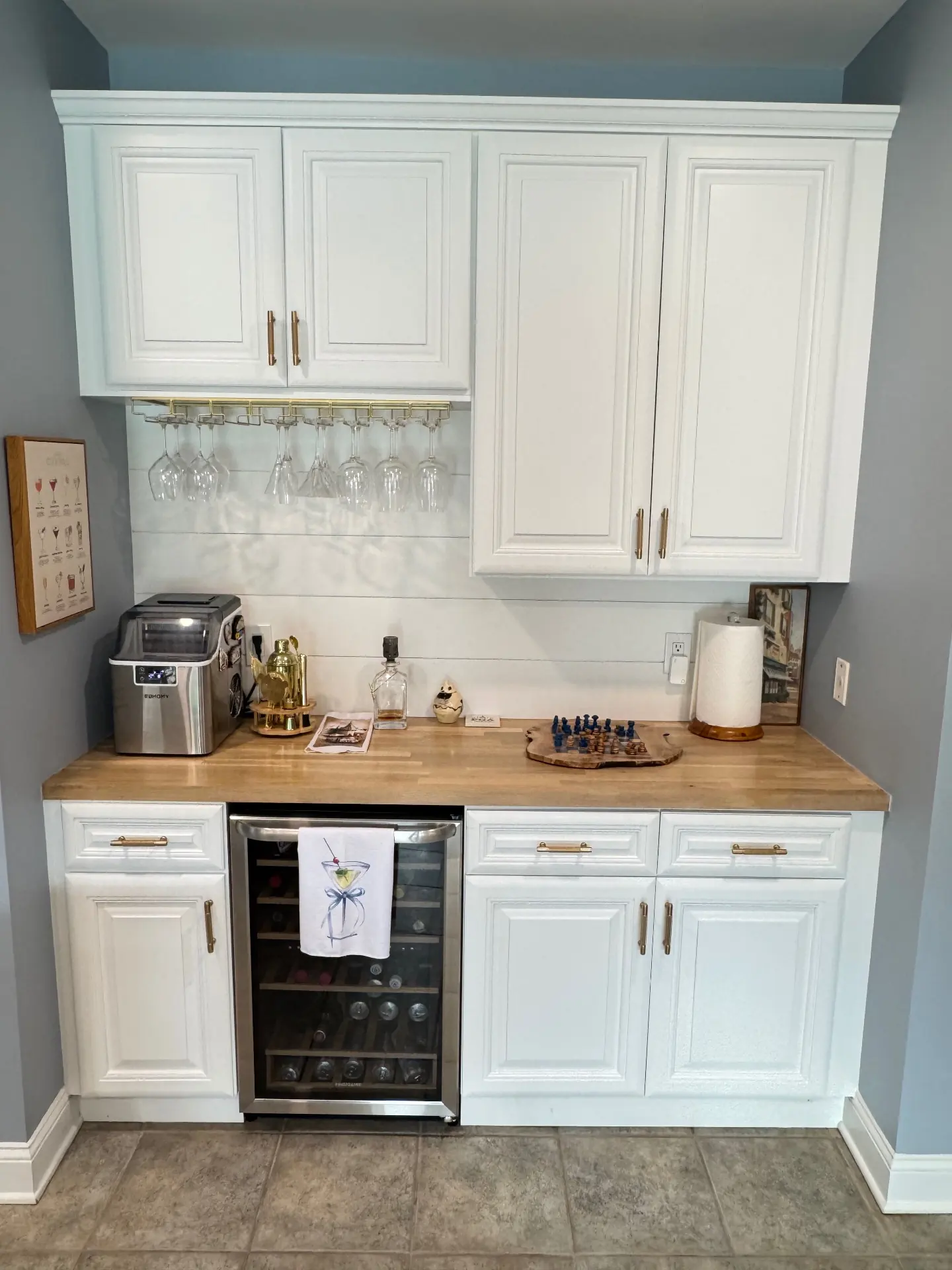 Custom beverage station with white cabinetry, wood countertop and wine refrigerator in Doylestown kitchen remodel