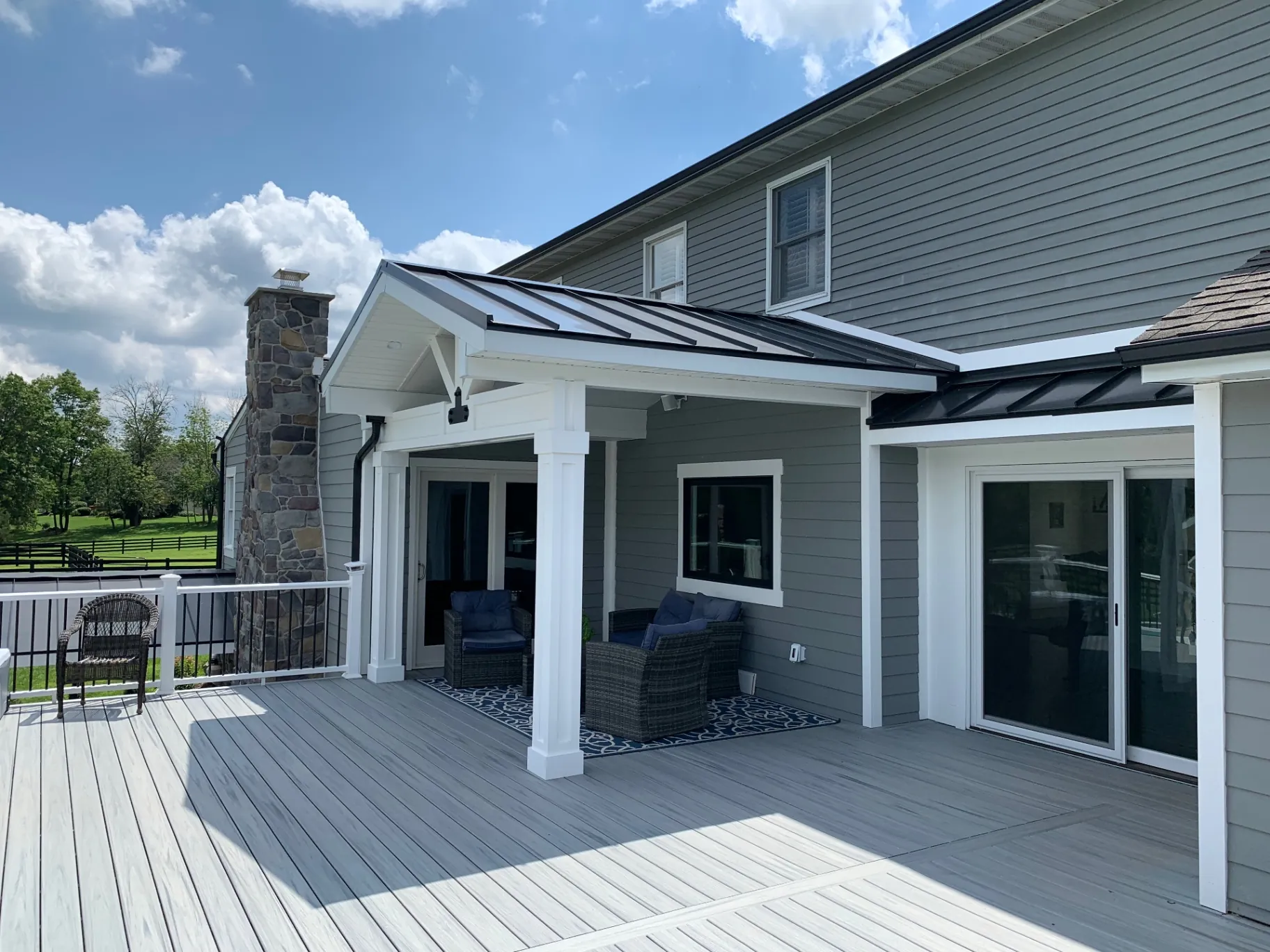 Composite deck with metal-roof covered area in Doylestown, PA